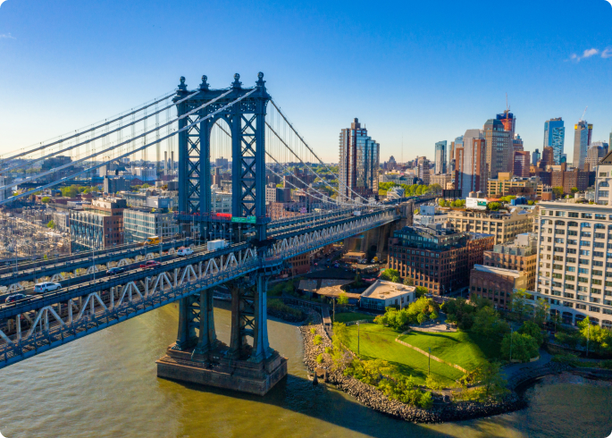 bridge over water leading to the city