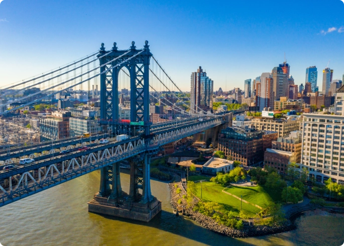 bridge over water leading to the city